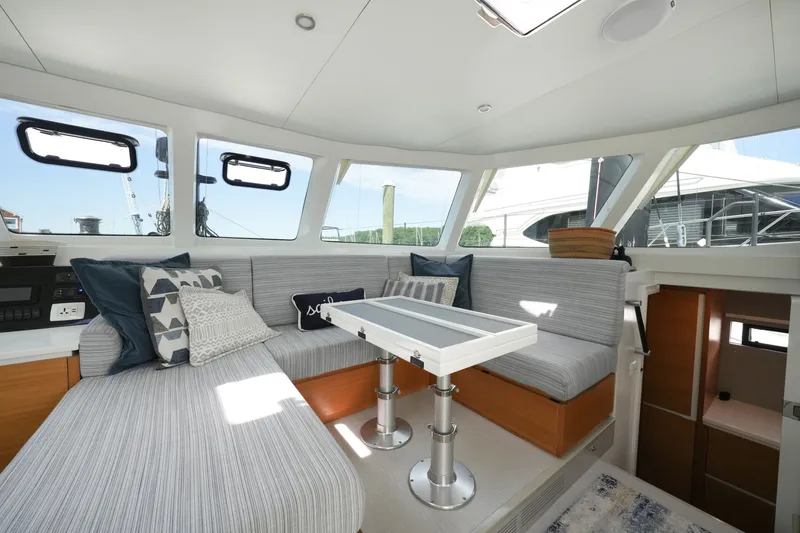 Slide: The Image of Interior of 2022 Balance 482 yacht with modern seating and table. - 26