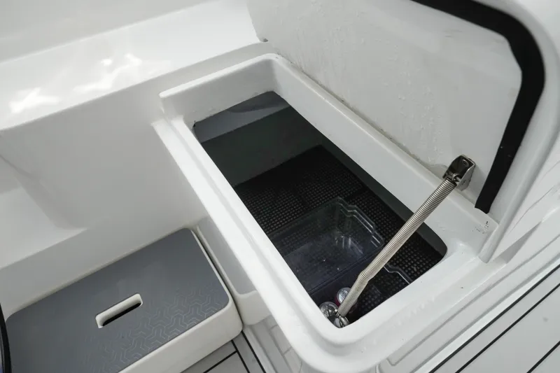 Slide: The Image of Open storage compartment in Balance 482 boat, 2022 model, with visible hinge and interior. - 15