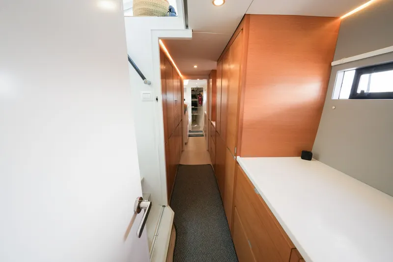 Slide: The Image of Modern interior hallway of 2022 Balance 482 yacht with sleek wooden cabinetry. - 49