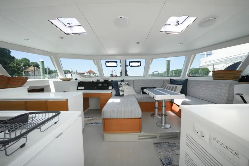 Slide: The Image of Luxurious interior of 2022 Balance 482 yacht with modern seating and panoramic windows. - 24