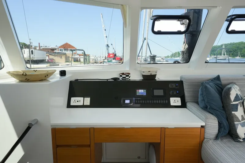 Slide: The Image of Interior of 2022 Balance 482 yacht with control panel and scenic marina view. - 35