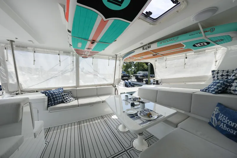 Slide: The Image of Luxurious interior of 2022 Balance 482 yacht with surfboards and elegant seating area. - 9