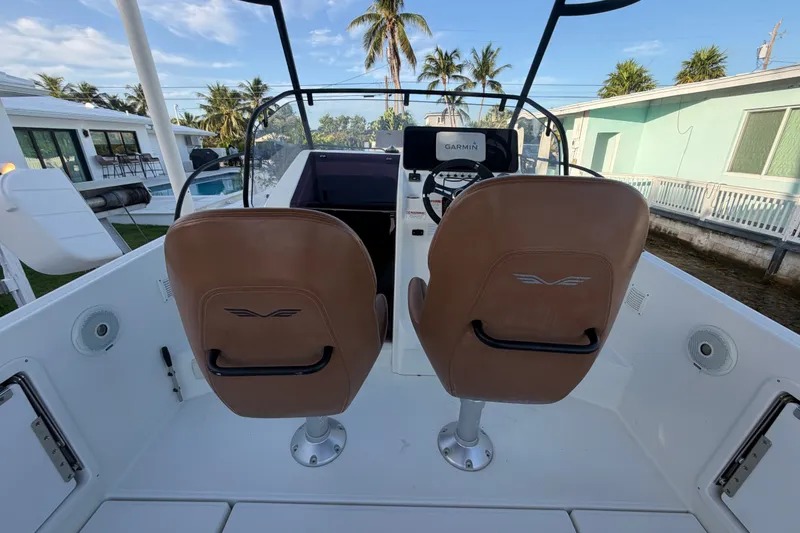 Slide: The Image of 2019 Beneteau Flyer 7.7 SPACEdeck cockpit with dual seats and Garmin navigation system. - 15
