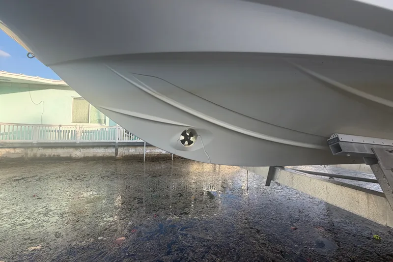 Slide: The Image of 2019 Beneteau Flyer 7.7 SPACEdeck hull, docked, showcasing sleek design and craftsmanship. - 9