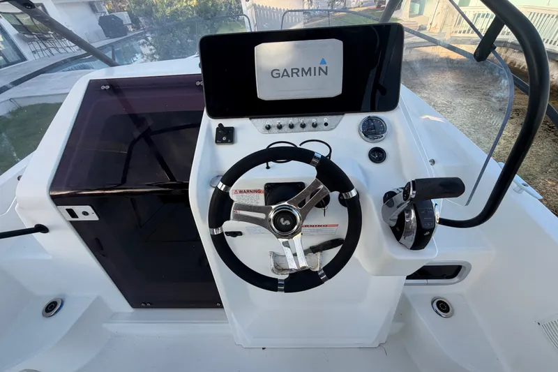 Slide: The Image of Cockpit of 2019 Beneteau Flyer 7.7 SPACEdeck with Garmin navigation system. - 18