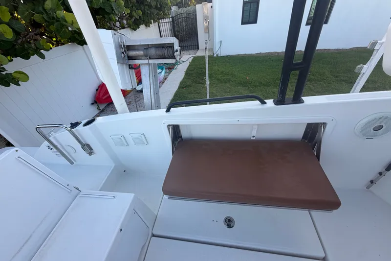 Slide: The Image of 2019 Beneteau Flyer 7.7 SPACEdeck boat interior with brown seat and white deck. - 33