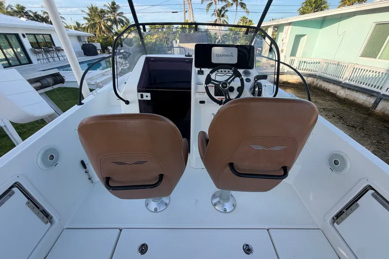 Slide: The Image of 2019 Beneteau Flyer 7.7 SPACEdeck cockpit with dual seats and Garmin navigation system. - 16