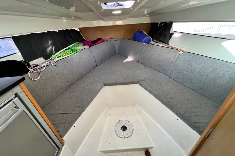 Slide: The Image of Interior of 2019 Beneteau Flyer 7.7 SPACEdeck with gray seating and storage. - 31