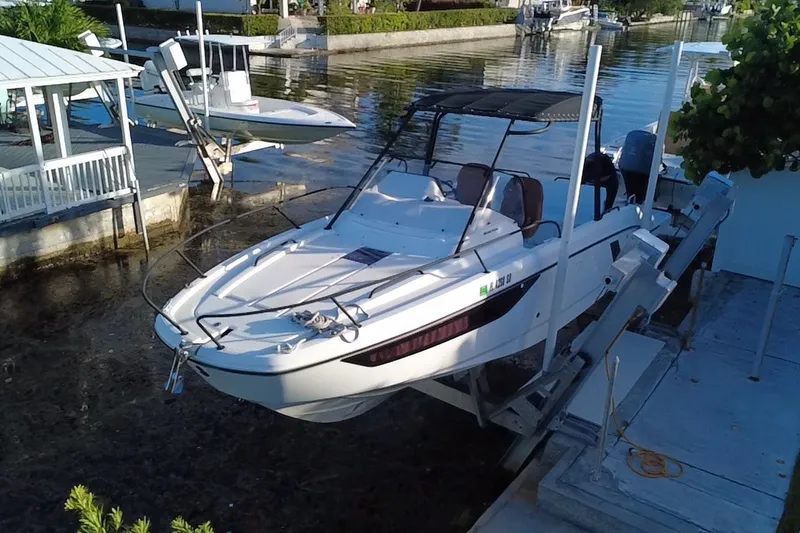 The Image of 2019 Beneteau Flyer 7.7 SPACEdeck boat docked by waterfront. - 3