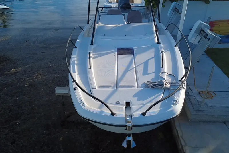 Slide: The Image of 2019 Beneteau Flyer 7.7 SPACEdeck boat docked by the water. - 4