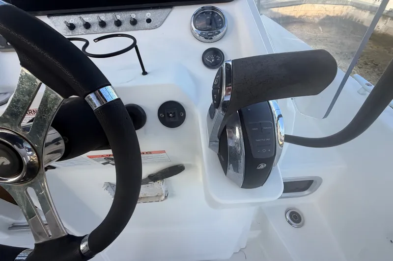 Slide: The Image of Steering console of 2019 Beneteau Flyer 7.7 SPACEdeck with throttle controls and gauges. - 26