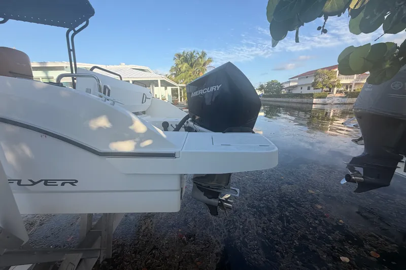 Slide: The Image of Beneteau Flyer 7.7 SPACEdeck 2019 with Mercury outboard motor by a canal. - 10
