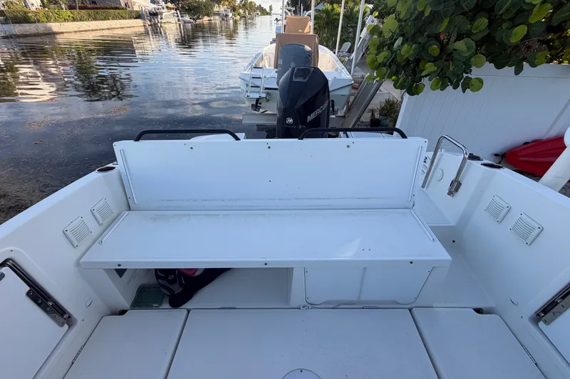 Slide: The Image of 2019 Beneteau Flyer 7.7 SPACEdeck boat interior with seating and outboard motor. - 14