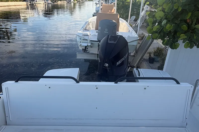 Slide: The Image of 2019 Beneteau Flyer 7.7 SPACEdeck with Mercury outboard motor docked by water. - 35
