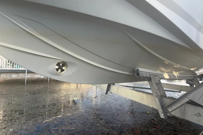 Slide: The Image of 2019 Beneteau Flyer 7.7 SPACEdeck hull on trailer, showcasing sleek design and propeller detail. - 8
