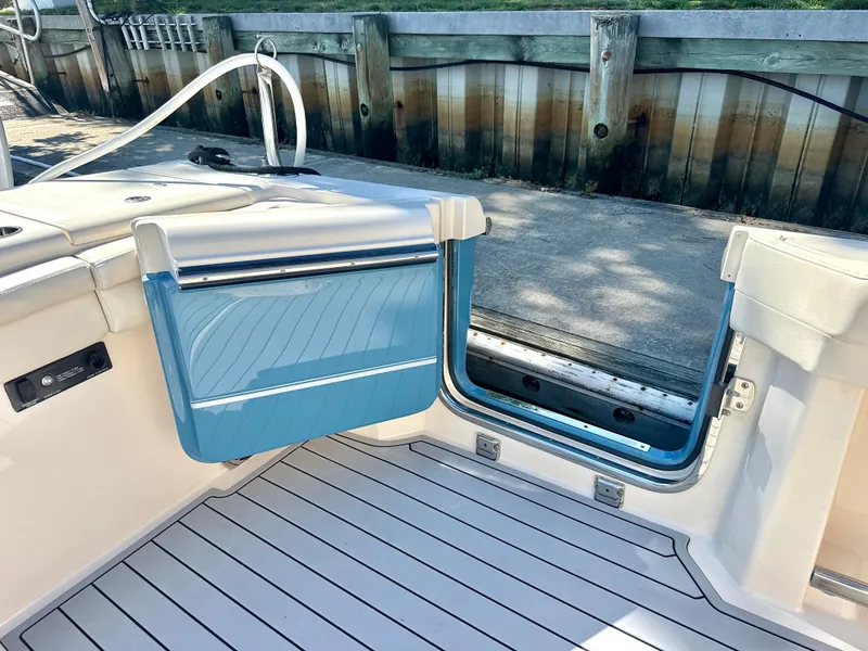 Slide: The Image of The image shows the cockpit of a 2020 Grady-White Canyon 456 with blue accents. - 49