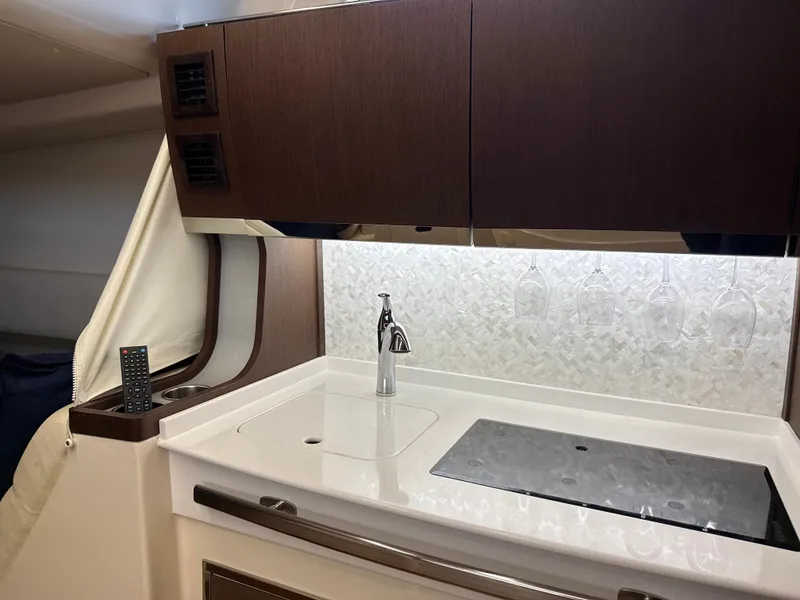 Slide: The Image of Interior of the Grady-White Canyon 456 featuring a modern kitchenette. - 44