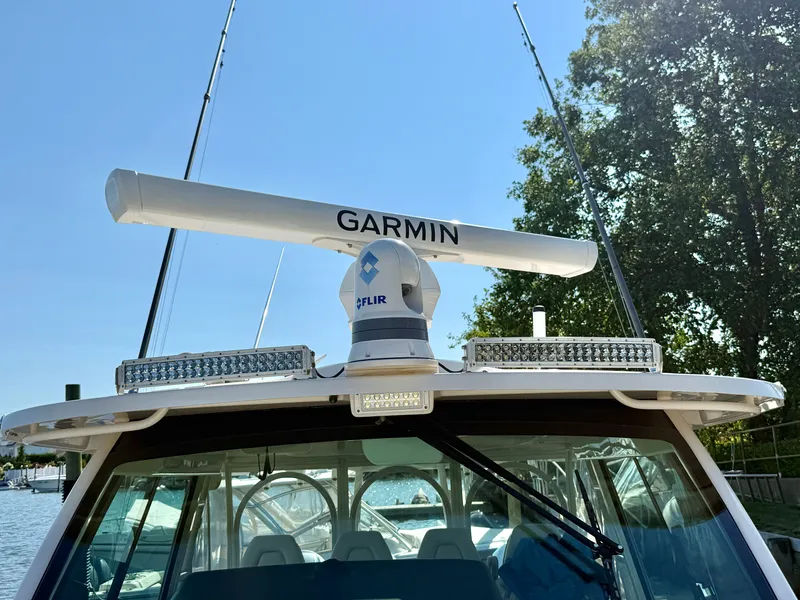 Slide: The Image of The image shows a Grady-White Canyon 456 boat with Garmin and FLIR equipment. - 48