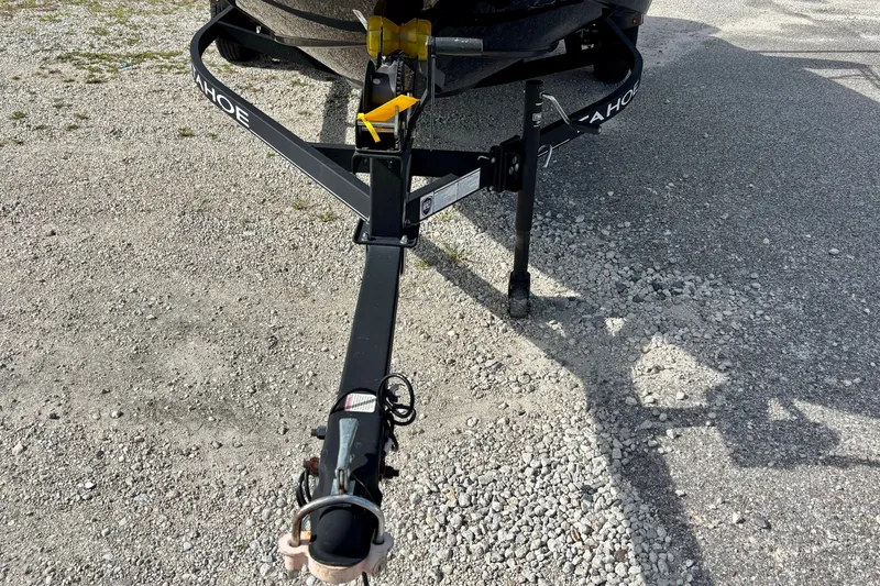 Slide: The Image of Trailer hitch of a 2024 Tahoe T16 on gravel surface. - 7