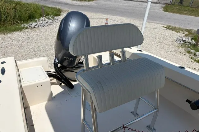 Slide: The Image of 2022 Jones Brothers Cape Fisherman 20 boat interior with seating and outboard motor. - 4