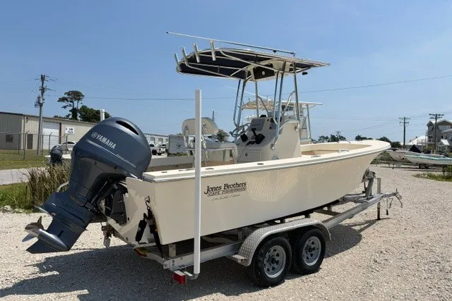 Slide: The Image of 2022 Jones Brothers Cape Fisherman 20 boat on trailer with Yamaha outboard motor. - 1