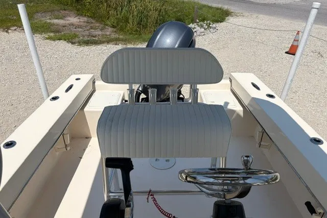 Slide: The Image of 2022 Jones Brothers Cape Fisherman 20 boat interior with steering wheel and seating. - 5