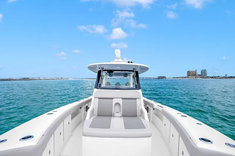 Slide: The Image of 2025 Solace 37CS boat on open water with clear blue sky. - 100