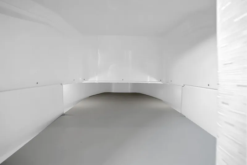 Slide: The Image of Interior view of 2025 Solace 37CS, showcasing spacious white storage compartment. - 35