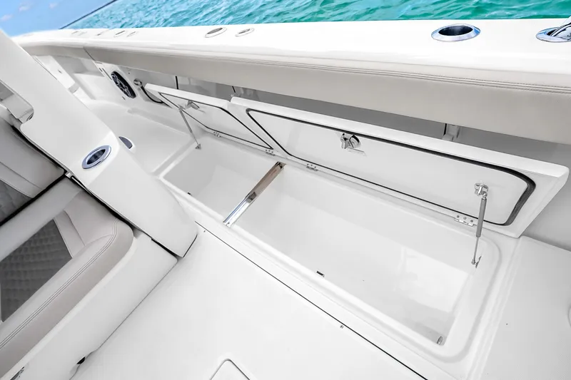 Slide: The Image of Open storage compartment on 2025 Solace 37CS boat, showcasing sleek design and ample space. - 82