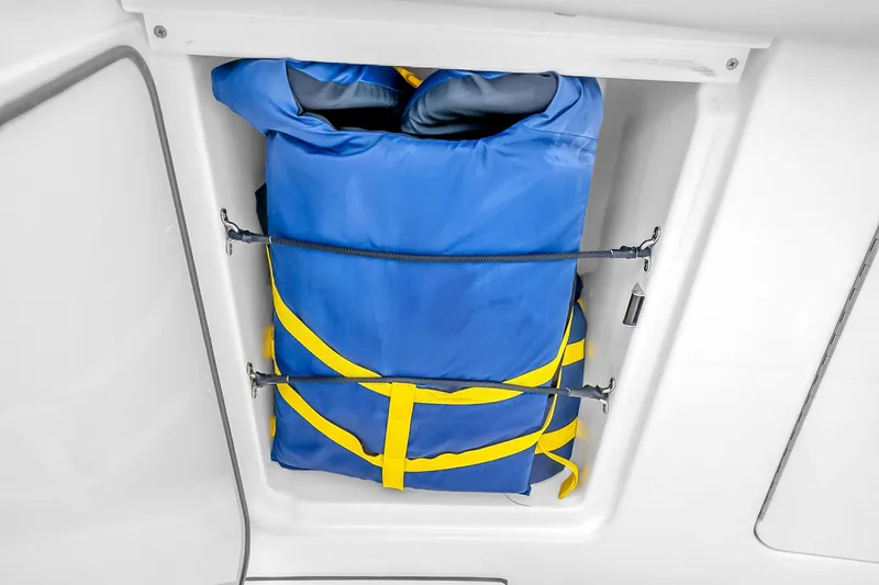 Slide: The Image of Blue and yellow life jacket stored in Solace 37CS boat compartment, 2025 model. - 65