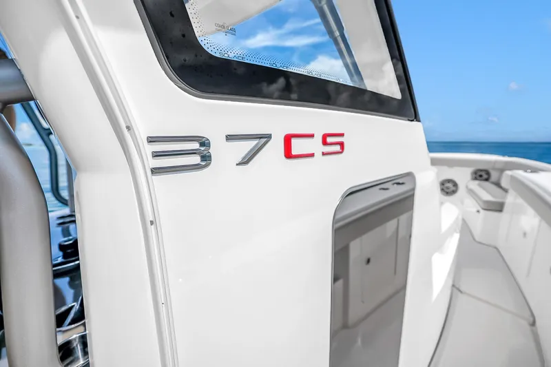 Slide: The Image of 2025 Solace 37CS boat detail with sleek design and ocean backdrop. - 73