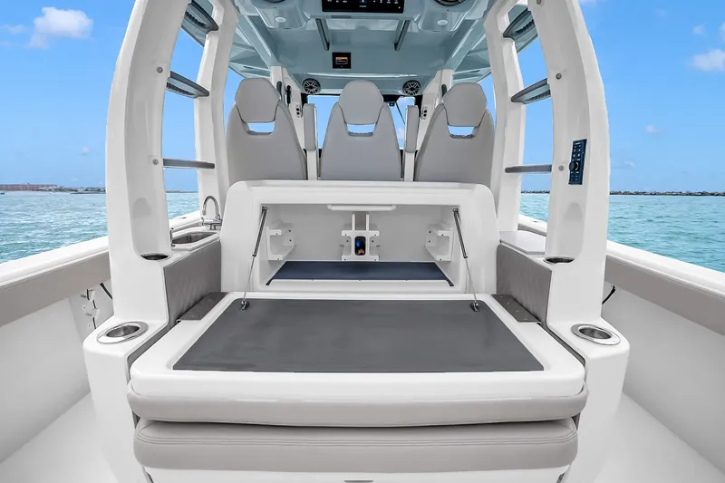 Slide: The Image of 2025 Solace 37CS boat interior with seating and storage, on a sunny day at sea. - 55