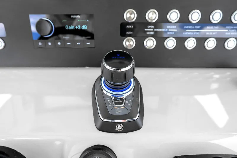 Slide: The Image of Control panel of 2025 Solace 37CS boat featuring joystick and button interface. - 50