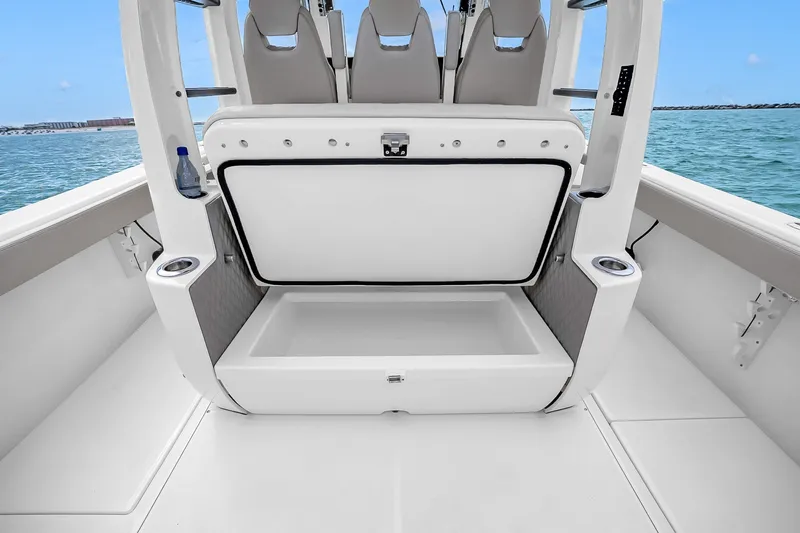 Slide: The Image of 2025 Solace 37CS boat with open storage compartment, ocean view in background. - 56