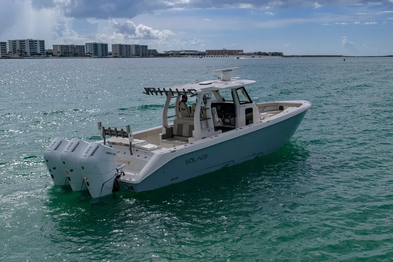 Slide: The Image of 2025 Solace 37CS boat on calm ocean waters under a partly cloudy sky. - 26