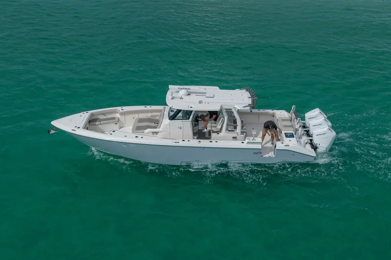Slide: The Image of 2025 Solace 37CS boat cruising on clear turquoise water. - 20