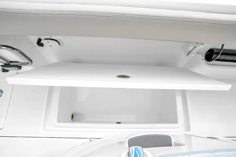 Slide: The Image of 2025 Solace 37CS boat storage compartment with open lid, showcasing sleek design and functionality. - 84