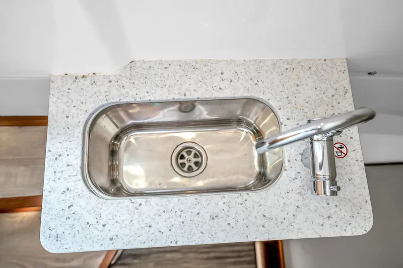 Slide: The Image of Stainless steel sink with modern faucet on speckled countertop in 2025 Solace 37CS. - 91