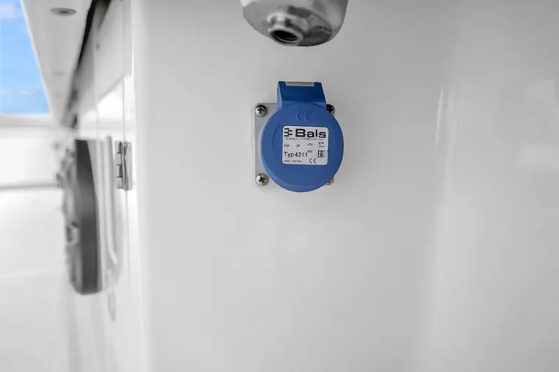 Slide: The Image of Blue electrical outlet on Solace 37CS boat, 2025 model. - 77