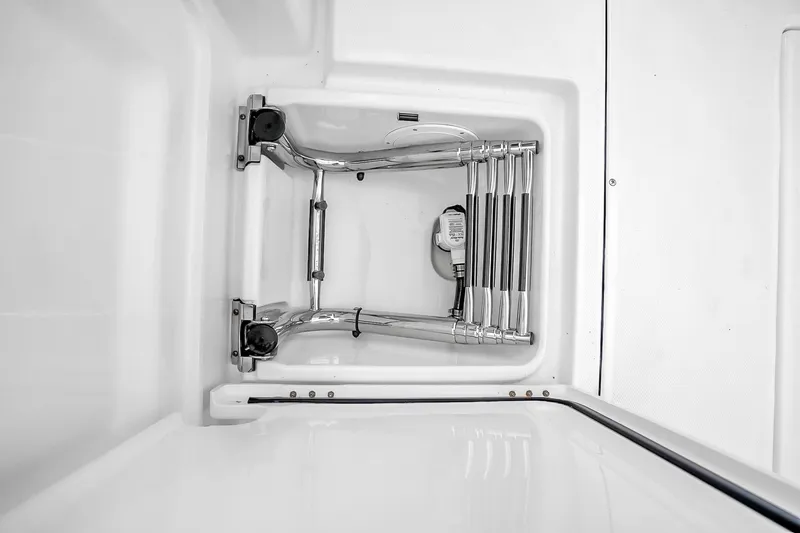 Slide: The Image of Stainless steel ladder on 2025 Solace 37CS boat, neatly folded in compartment. - 88