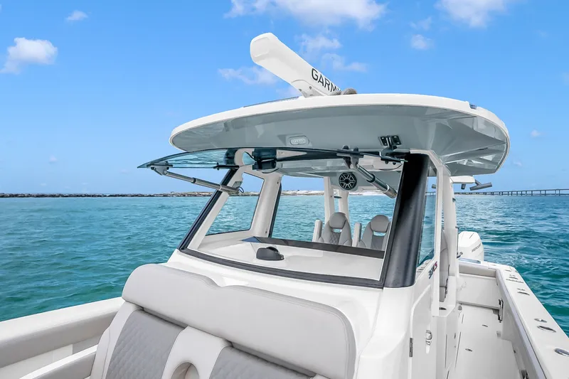 Slide: The Image of 2025 Solace 37CS boat on clear blue water under a sunny sky. - 93