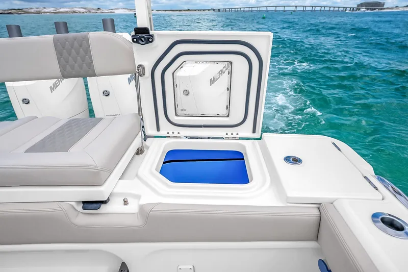 Slide: The Image of 2025 Solace 37CS boat interior with seating and storage, ocean backdrop. - 62