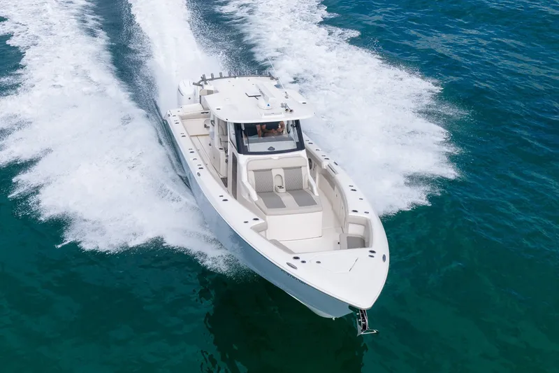 Slide: The Image of 2025 Solace 37CS boat cruising on clear blue ocean waters. - 16