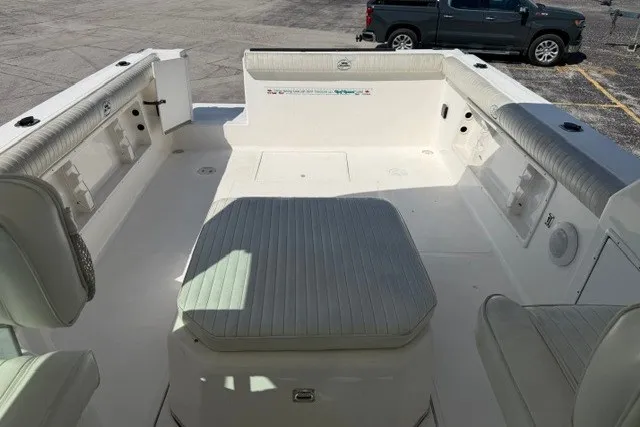 Slide: The Image of 2003 Baha Cruisers 277 GLE boat interior with cushioned seating and spacious deck area. - 15