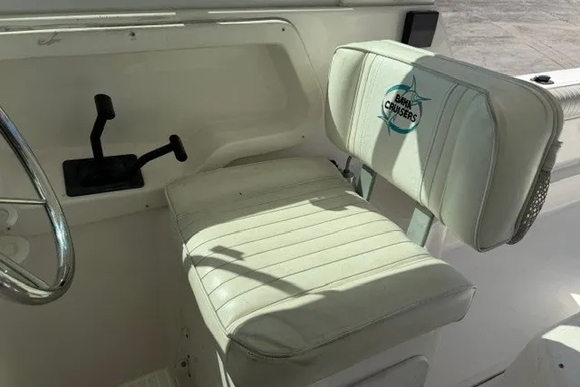 Slide: The Image of 2003 Baha Cruisers 277 GLE boat seat with steering wheel and controls. - 13