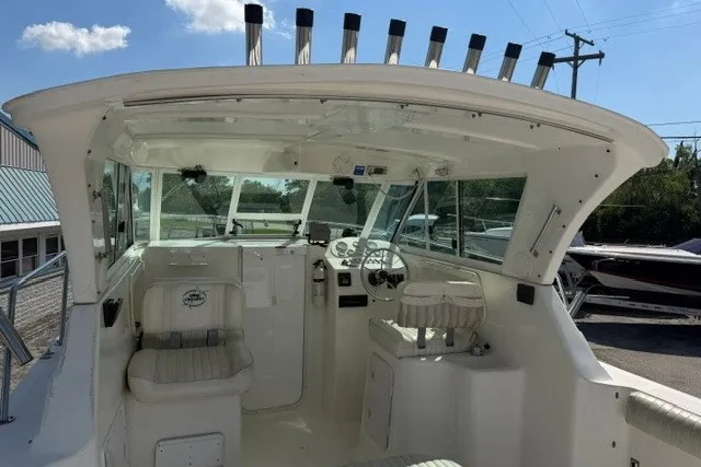 Slide: The Image of 2003 Baha Cruisers 277 GLE boat interior with helm and seating area. - 14