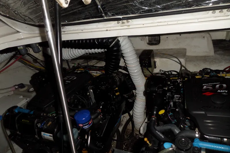 Slide: The Image of Engine compartment of a 2008 Bayliner 320 Cruiser with MerCruiser engines. - 59