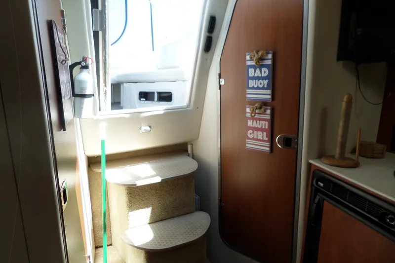 Slide: The Image of Interior of 2008 Bayliner 320 Cruiser with steps, door signs, and fire extinguisher. - 33