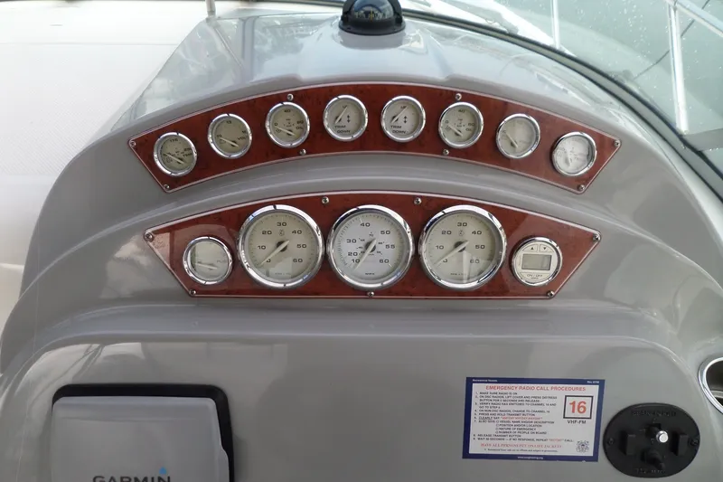 Slide: The Image of Dashboard of a 2008 Bayliner 320 Cruiser with gauges and controls. - 7