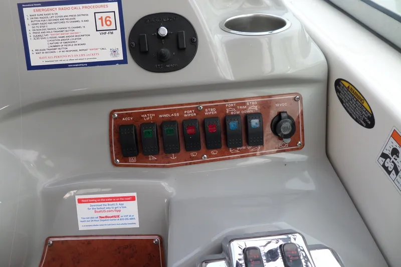 Slide: The Image of Control panel of a 2008 Bayliner 320 Cruiser with switches and emergency procedures. - 13